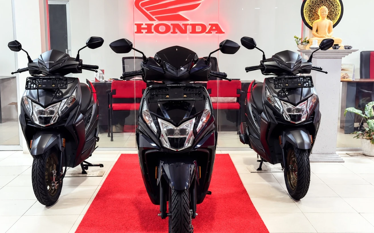 Honda Dio scooters displayed inside the Macro showroom