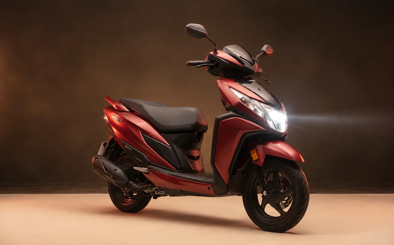 Red Dio 125 concept portrait with its headlamp illuminated